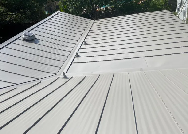Solar attic fan installed on a metal roof for Roof Ventilation in Bayshore Gardens